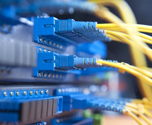 Fibre optic cables plugged into a splitter